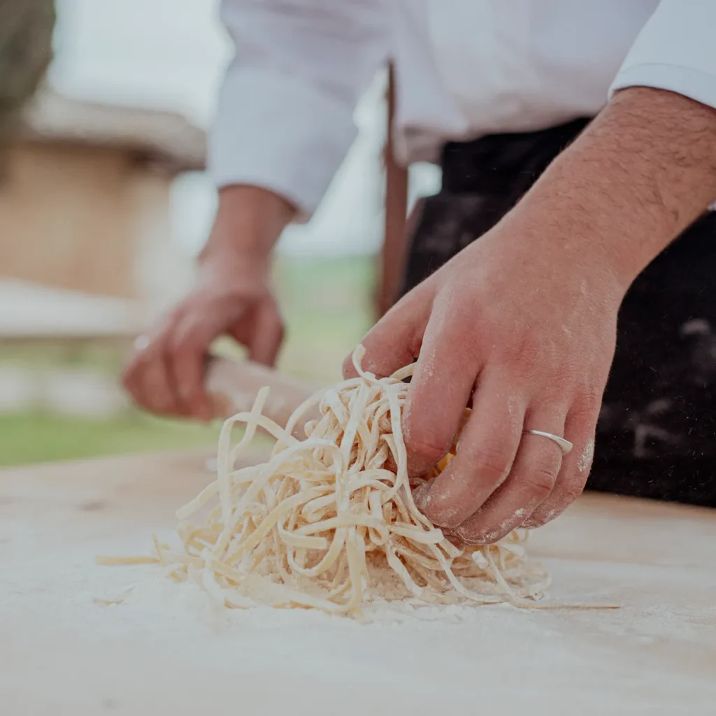 Chef making fresh pasta during a cooking class in Tuscany