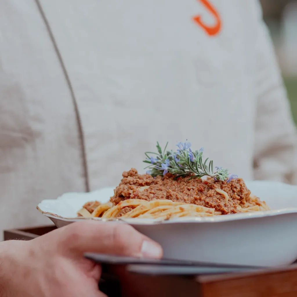 Plate of pasta with ragù served during a private dining experience in Tuscany