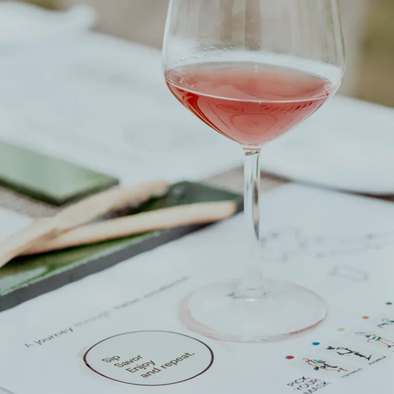 Glass of wine served during a private dining experience in Tuscany